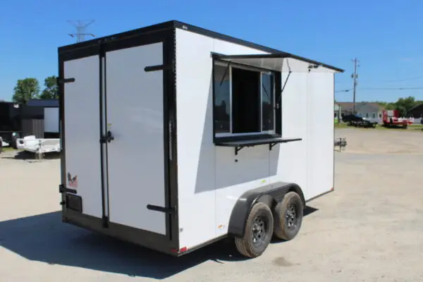 White enclosed concession trailer with serving window open
