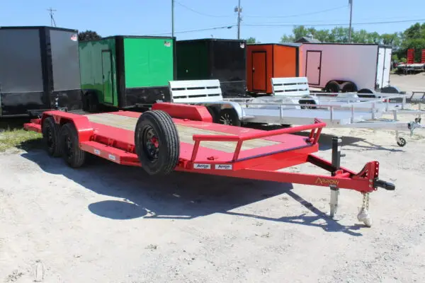 Red flatbed utility trailer in outdoor lot
