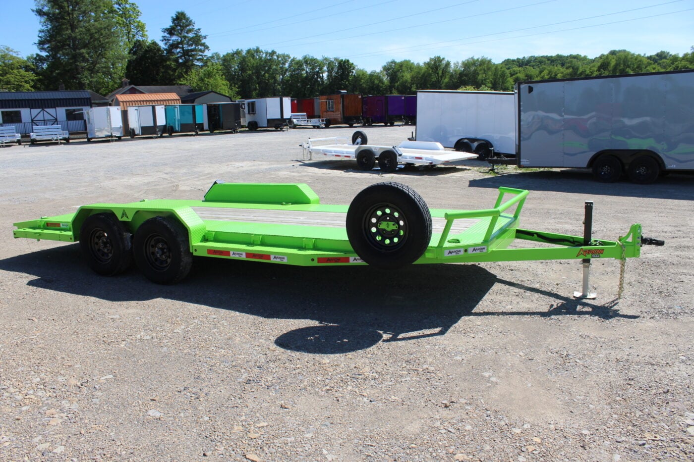 Bright green flatbed car hauler trailer on lot