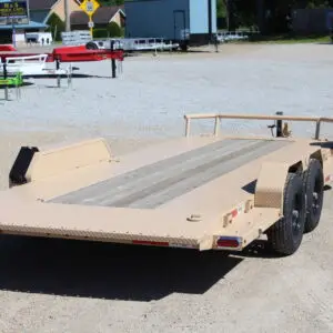 Tan dual-axle flatbed car hauler trailer