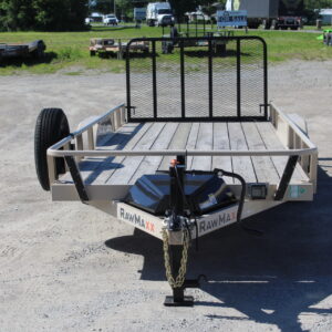 Utility trailer with mesh ramp gate on lot