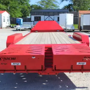 Red Arrow equipment trailer with loading ramps