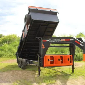 Black and orange gooseneck dump trailer raised
