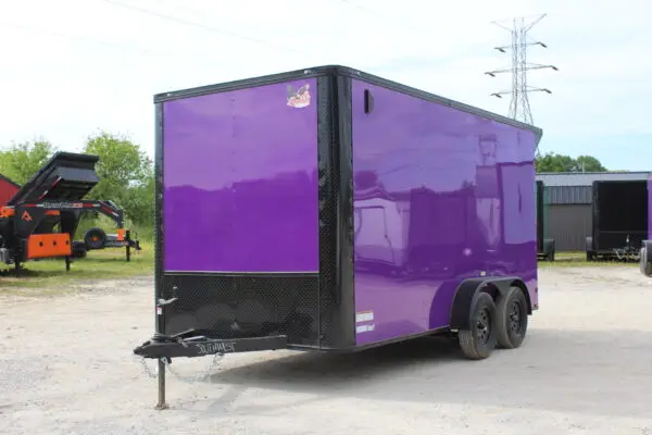 Purple enclosed dual-axle cargo trailer on lot