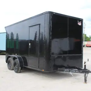 Black enclosed cargo trailer on dealership lot