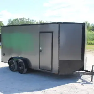 Gray enclosed dual-axle cargo trailer outdoors