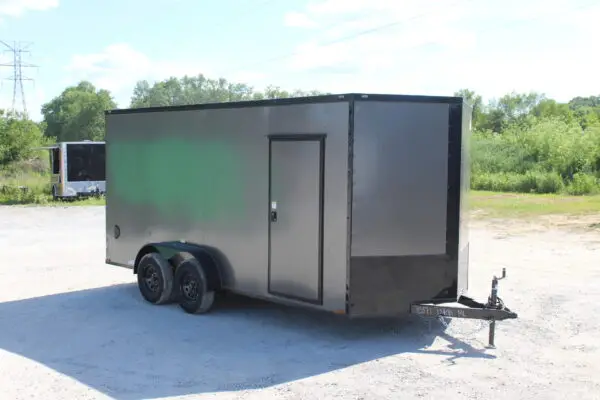 Gray enclosed dual-axle cargo trailer outdoors