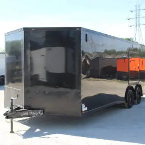 Black enclosed cargo trailer on gravel lot